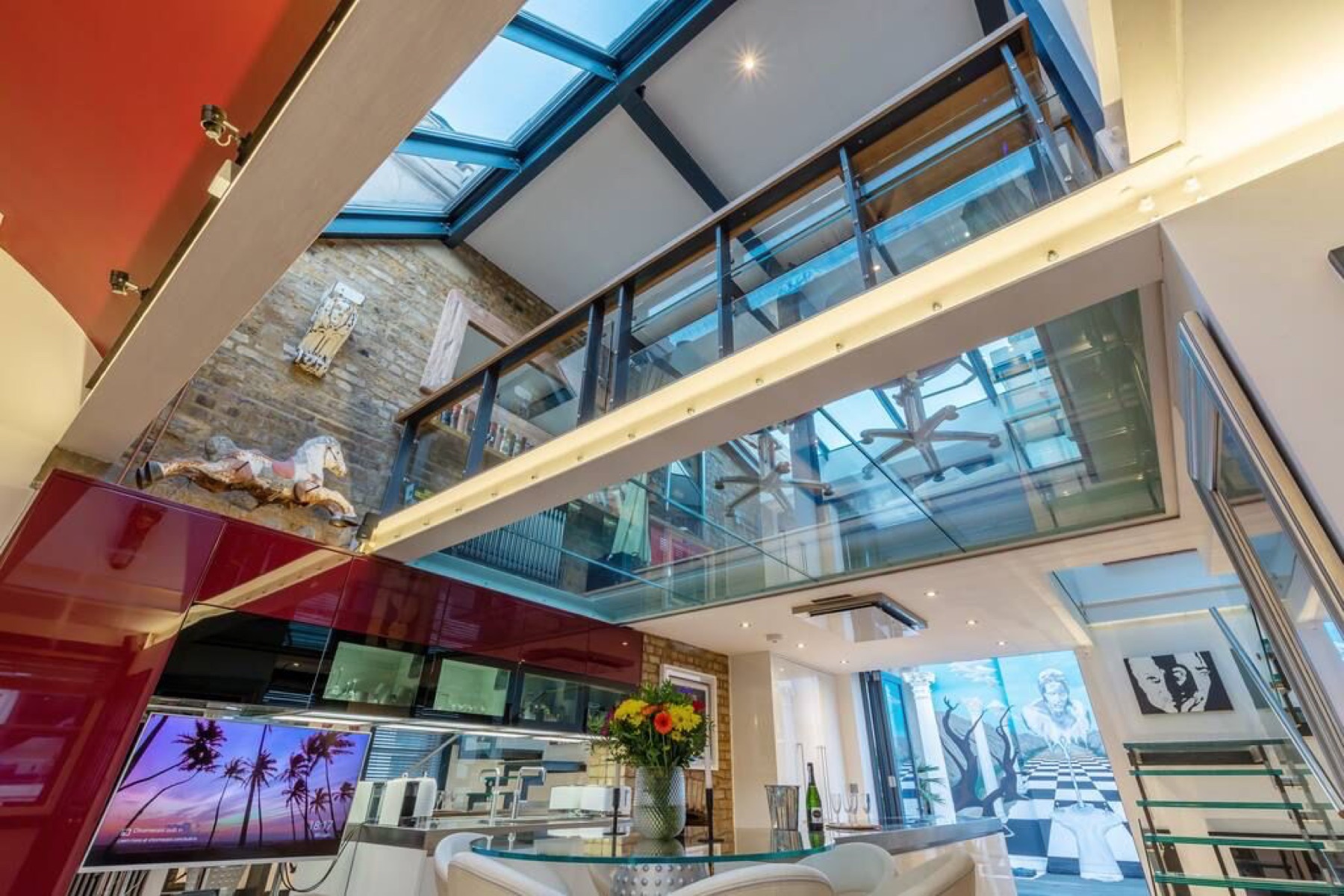Double-height interior with glass floors and rooflights