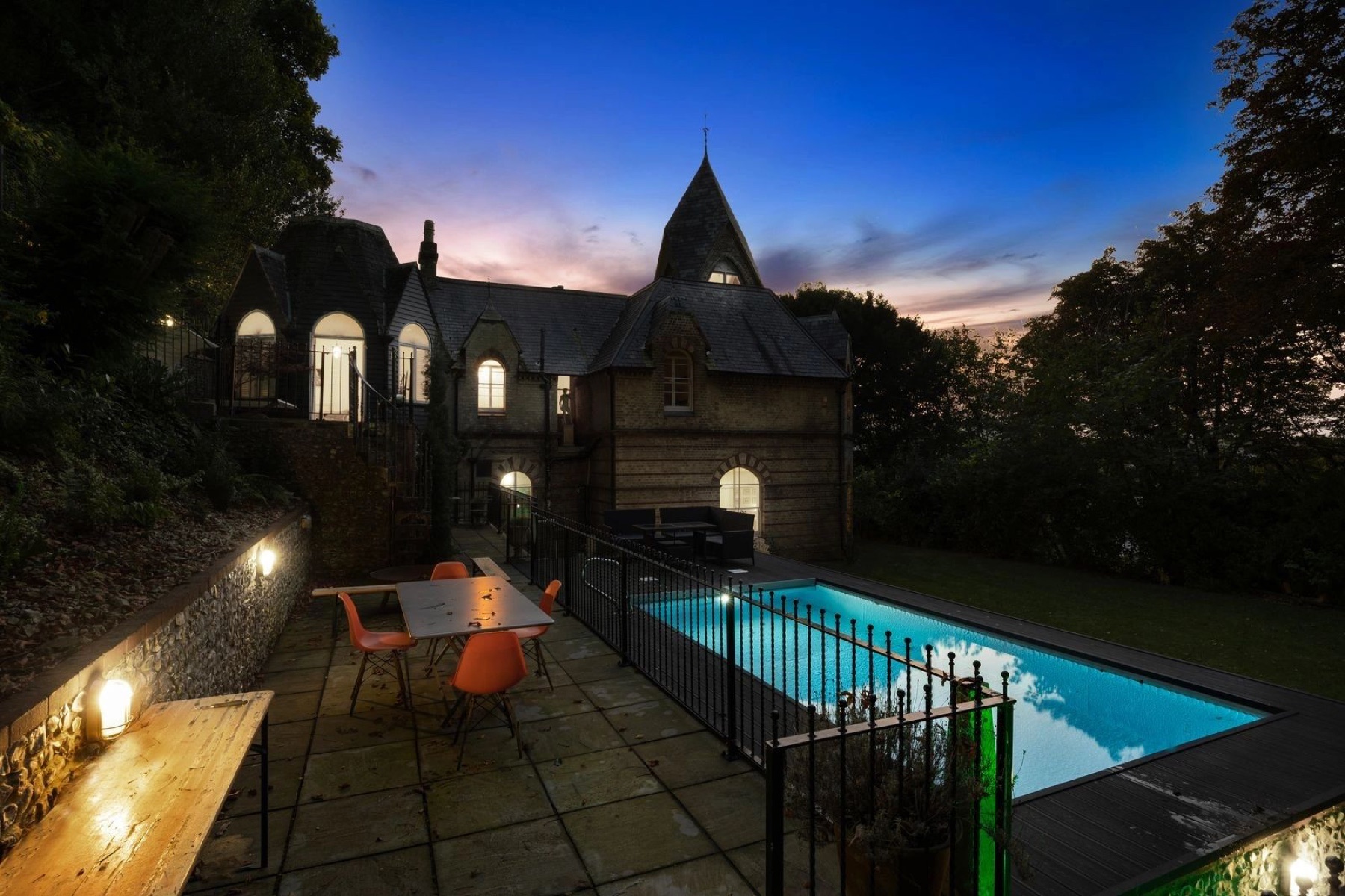 Undercliffe House and swimming pool at dusk